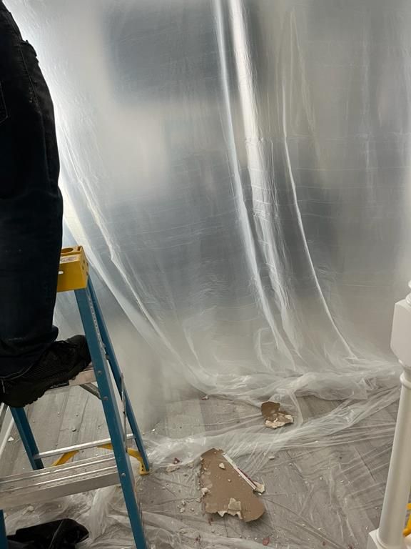 Plastic containment set up during restoration in Little River, SC