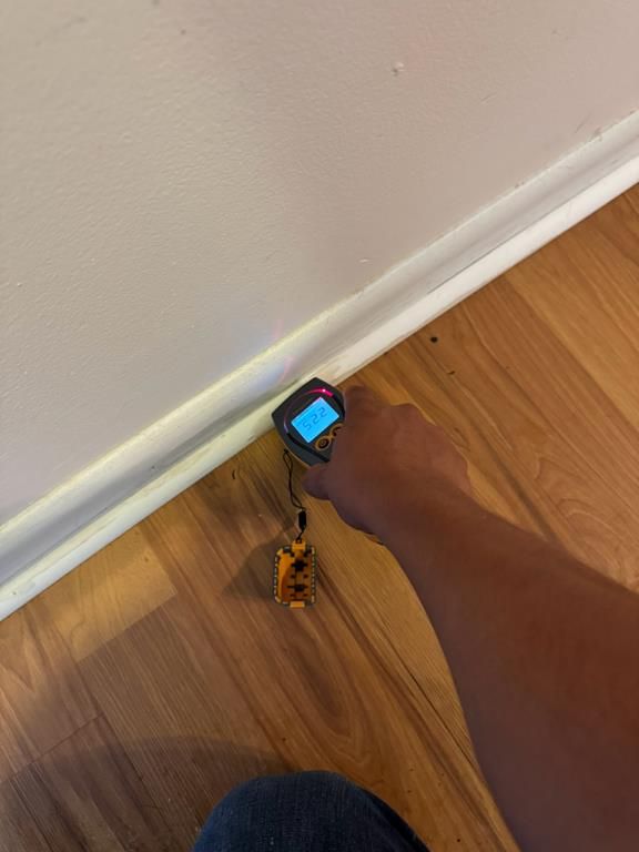 Technician checking moisture levels with a moisture meter in Pawleys Island, SC
